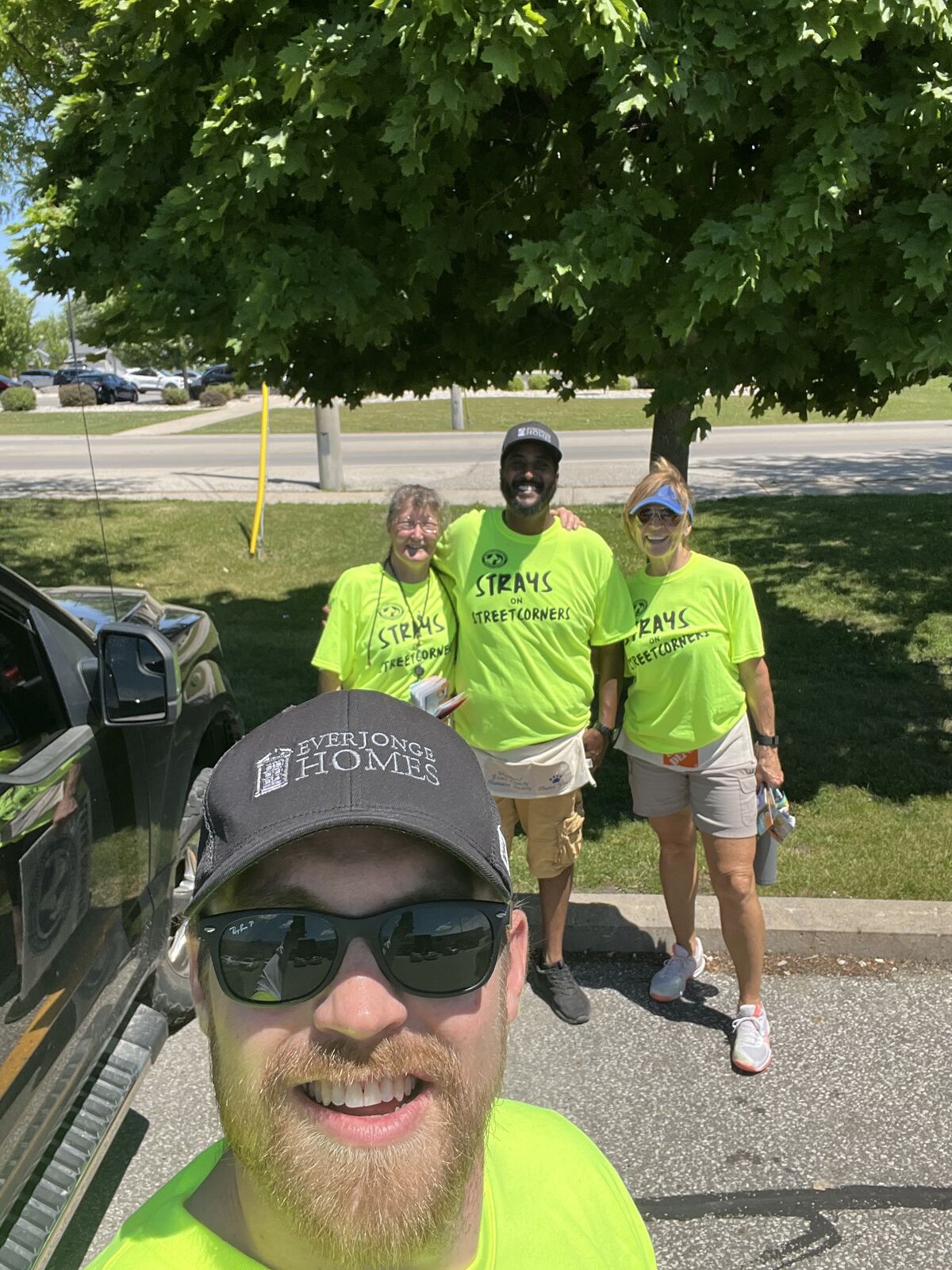 An EverJonge team member with volunteers at Strays on Streetcorners