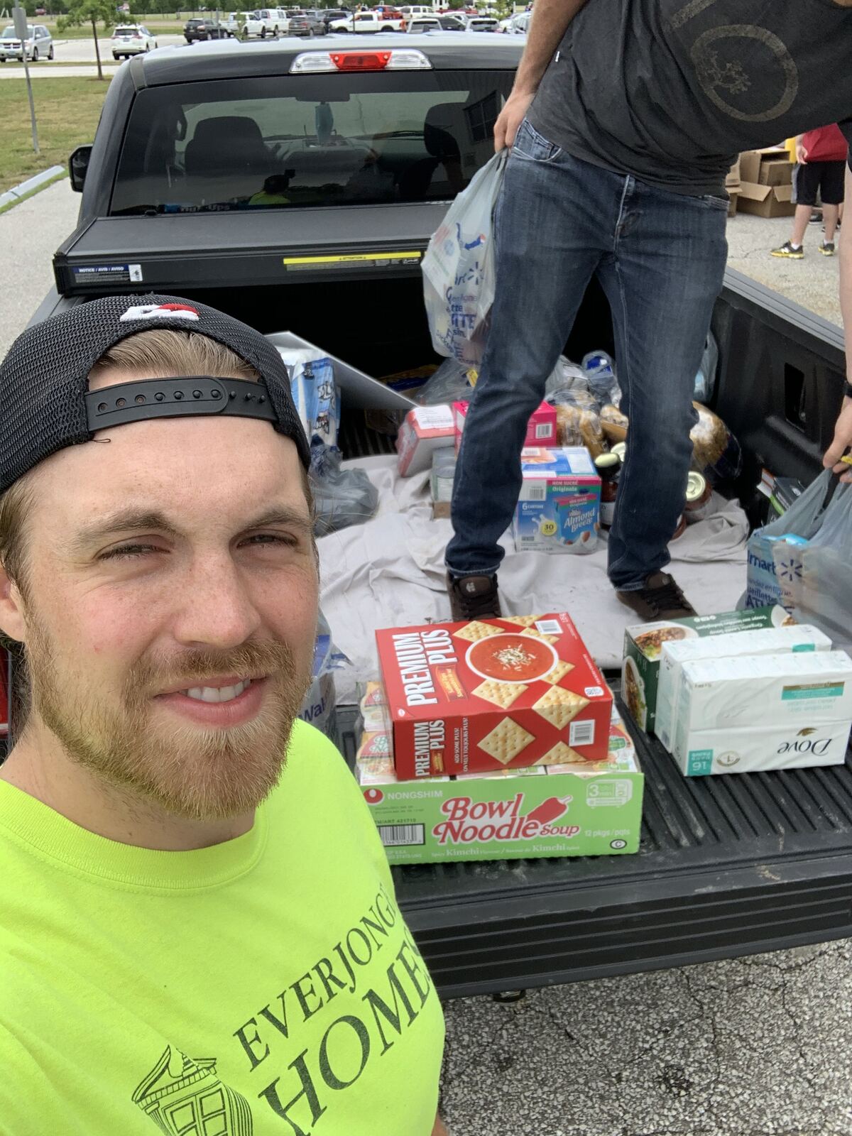 A truck bed filled with donated groceries and household essentials