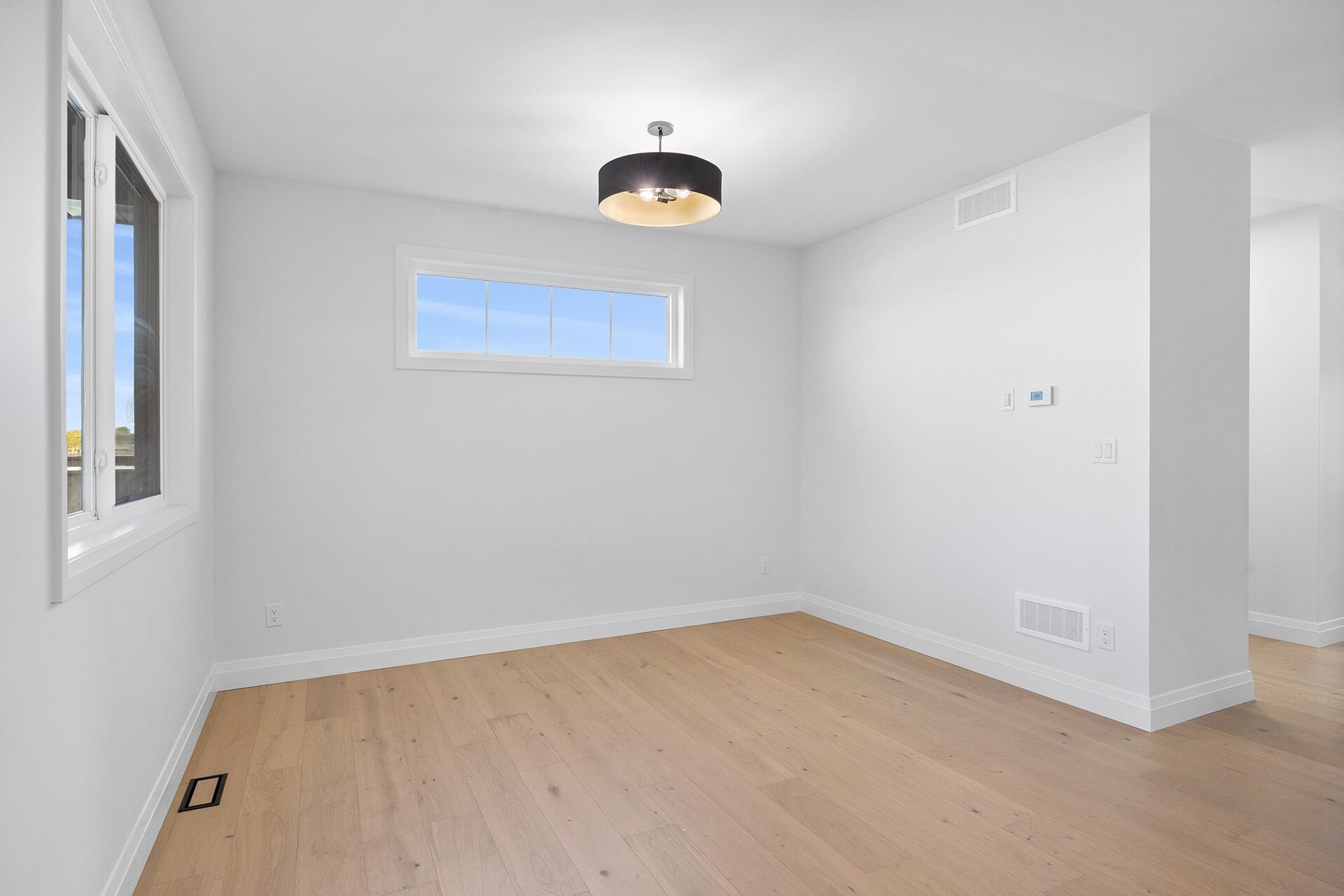 Dining area in an Erie Isle home with pendant lighting