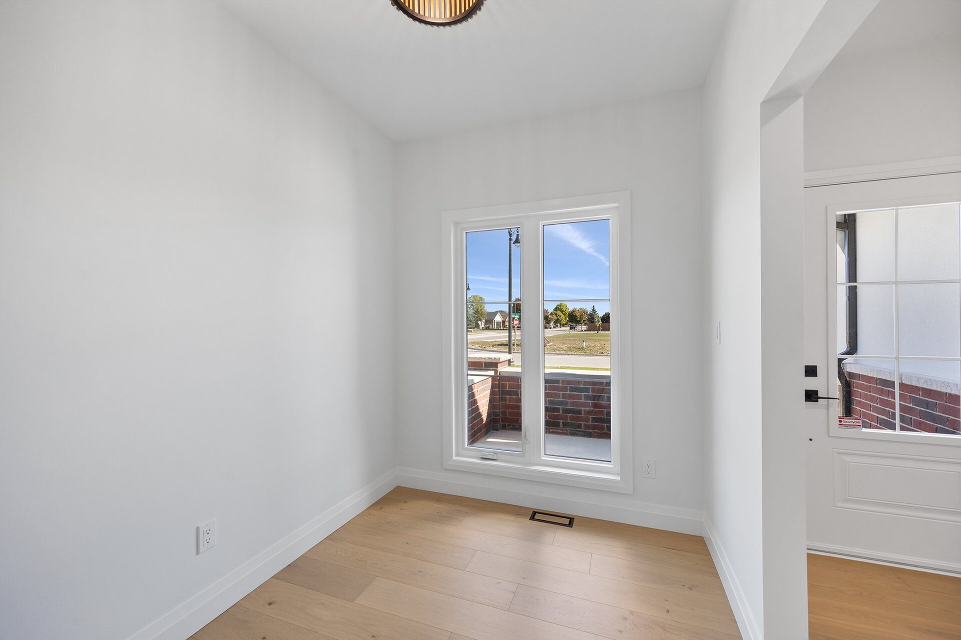 Front room off the entry, with a window to the street