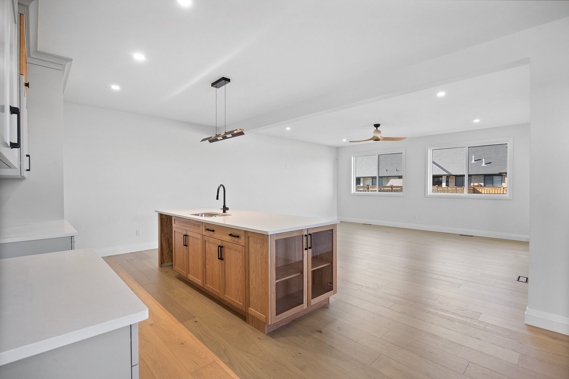 Kitchen island looking through to the living area, hardwood running throughout